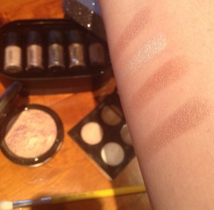 Swatches of Mac shadows from top to bottom; All That Glitters, nylon, Woodwinked, Satin Taupe